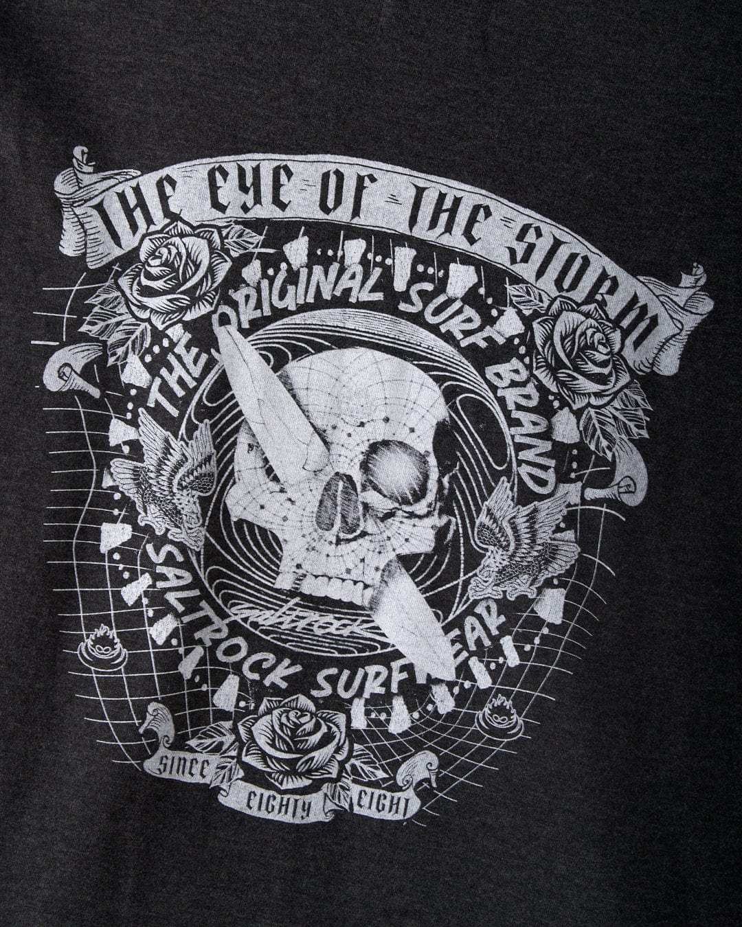 Crafted with a crew neckline, the Eye Of The Storm 2 Men's Long Sleeve T-Shirt in Grey from Saltrock features a graphic tee design that includes skull/surf graphics along with roses and a surfboard. It highlights "The Eye of the Storm" and carries the iconic Saltrock branding: "The Original Surf Brand" and "Saltrock Surfwear," making it your go-to choice since '88.