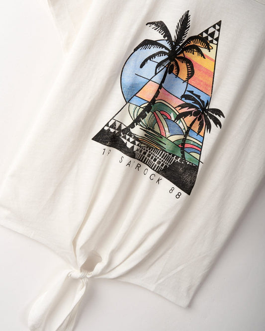 White 100% Cotton T-shirt featuring a colorful triangular graphic of a beach sunset, palm trees, and abstract shapes. Text at the bottom reads "Saltrock 88." Shirt is tied in a knot at the front hem. Introducing the *Geo Beach - Womens Tie Front T-Shirt - White* from *Saltrock*.