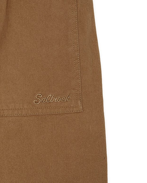 A pair of Hilda Twill - Womens Trouser - Light Brown shorts with a Saltrock logo on them.