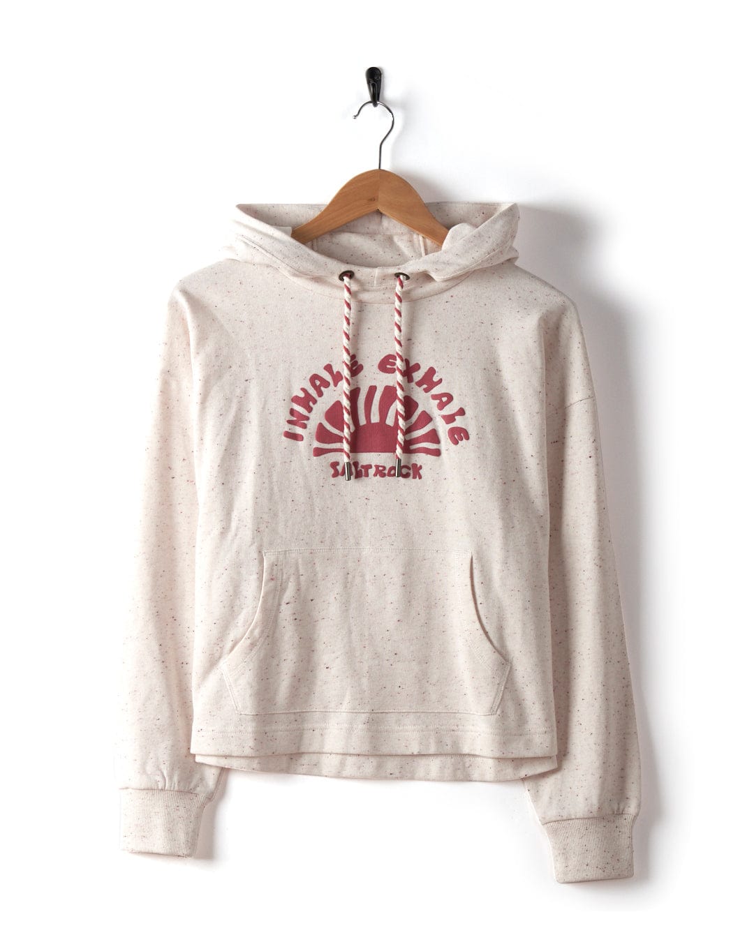 The Kellie - Women's Cropped Pop Hoodie in cream from Saltrock features red text and graphics, a drawstring hood, and a front pocket. The cropped design at the waist showcases the "Whale Change Sibiranka" slogan in Saltrock puffed print and is made from recycled materials.