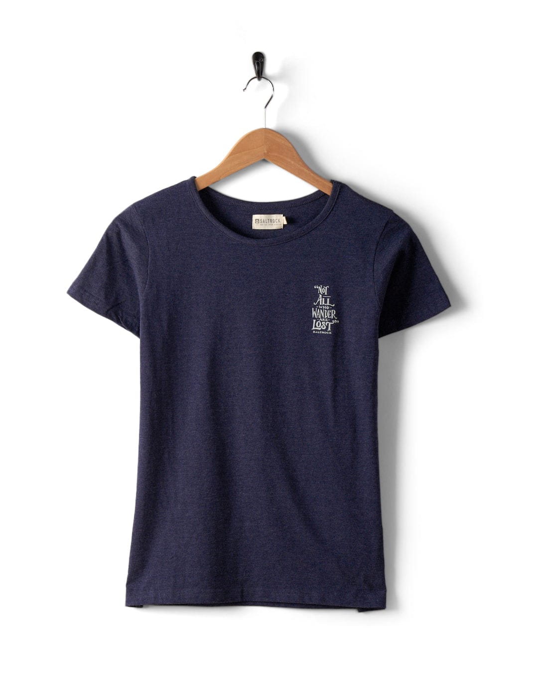 A Lost Ships - Womens T-Shirt in blue from Saltrock is hanging on a wooden hanger with the text "The All Nighter Light" printed in white on the left chest. Made of 100% cotton, this machine washable tee promises comfort and durability.