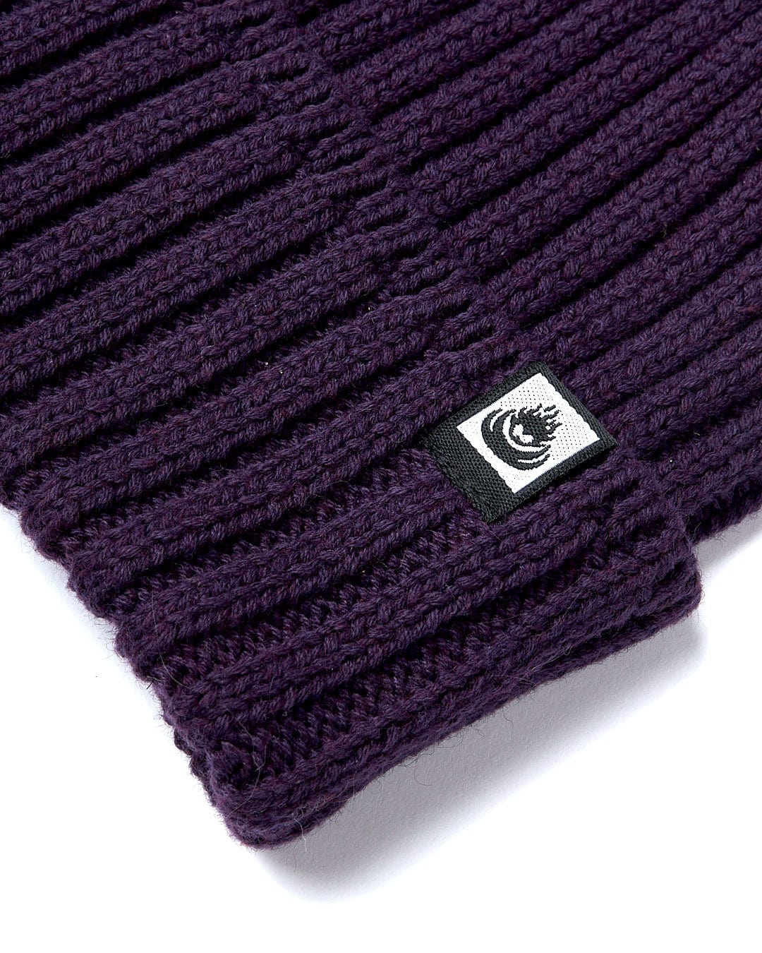 A Maine - Fisherman Beanie - Dark Purple by Saltrock on a white surface.