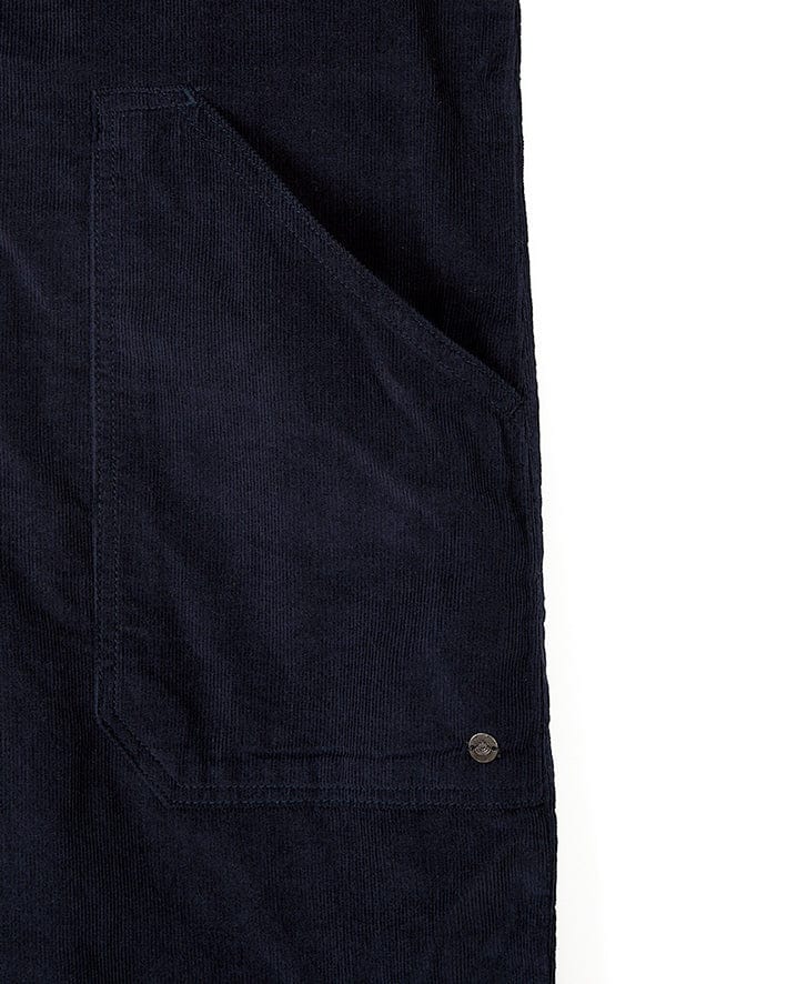 Image of a close-up view of a dark blue corduroy garment pocket, likely from the fashionable Saltrock Nancy - Womens Cord Jumpsuit - Dark Blue. The pocket features a single metallic button on its bottom right corner. The background is white.