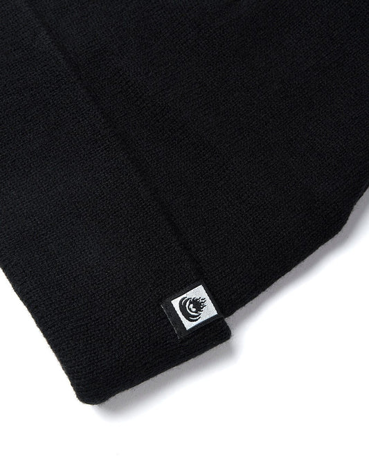 A Saltrock Ok - Tight Knit Beanie - Black with a small logo on it.