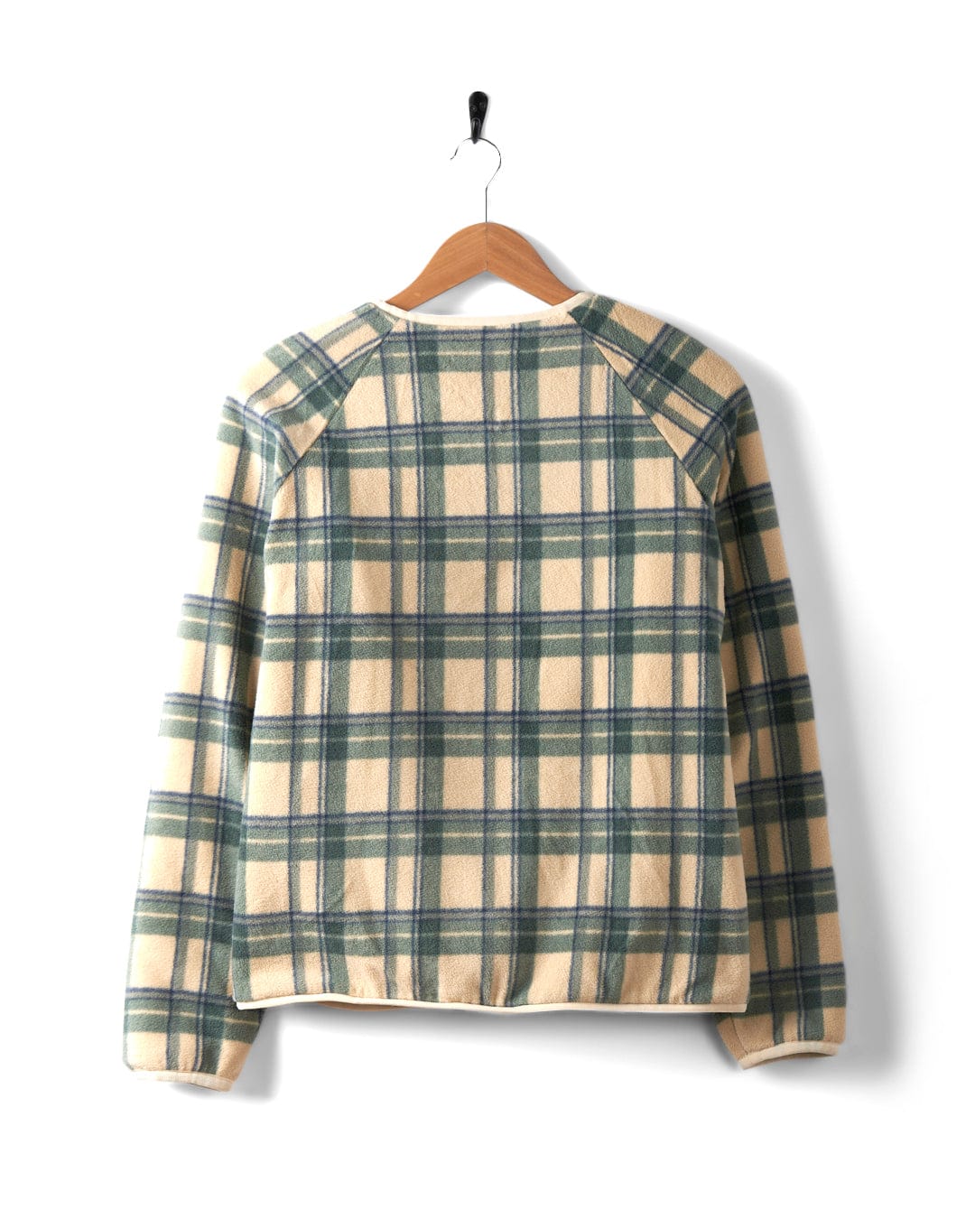 A back view of the Piper - Womens Reversible Zip Collarless Fleece in a cream and beige plaid design, crafted from recycled materials, hanging on a wooden hanger against a white background.