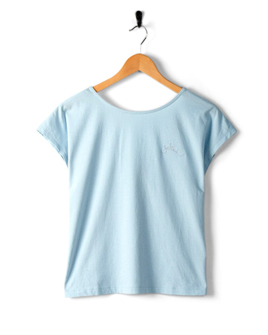 Rhoda - Womens T-Shirt - Light Blue by Saltrock, made of 100% cotton, hanging on a wooden hanger against a white background.