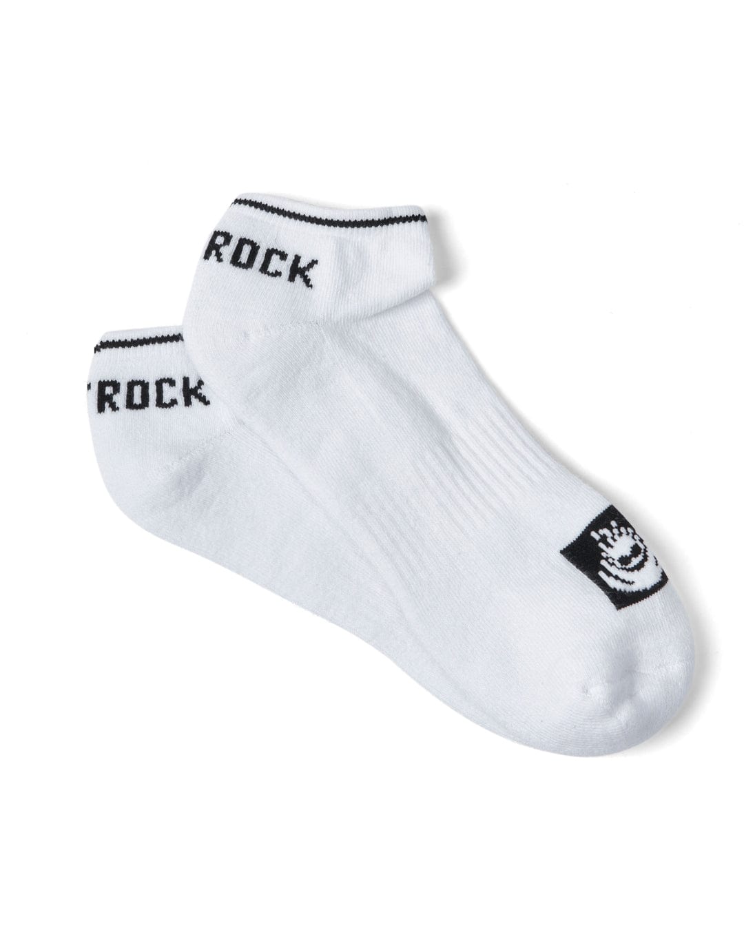 A pair of Saltrock Sneaker - Ankle Socks - White featuring black trim and the word "ROCK" on the cuff, along with a printed Saltrock branding logo on the toe area.