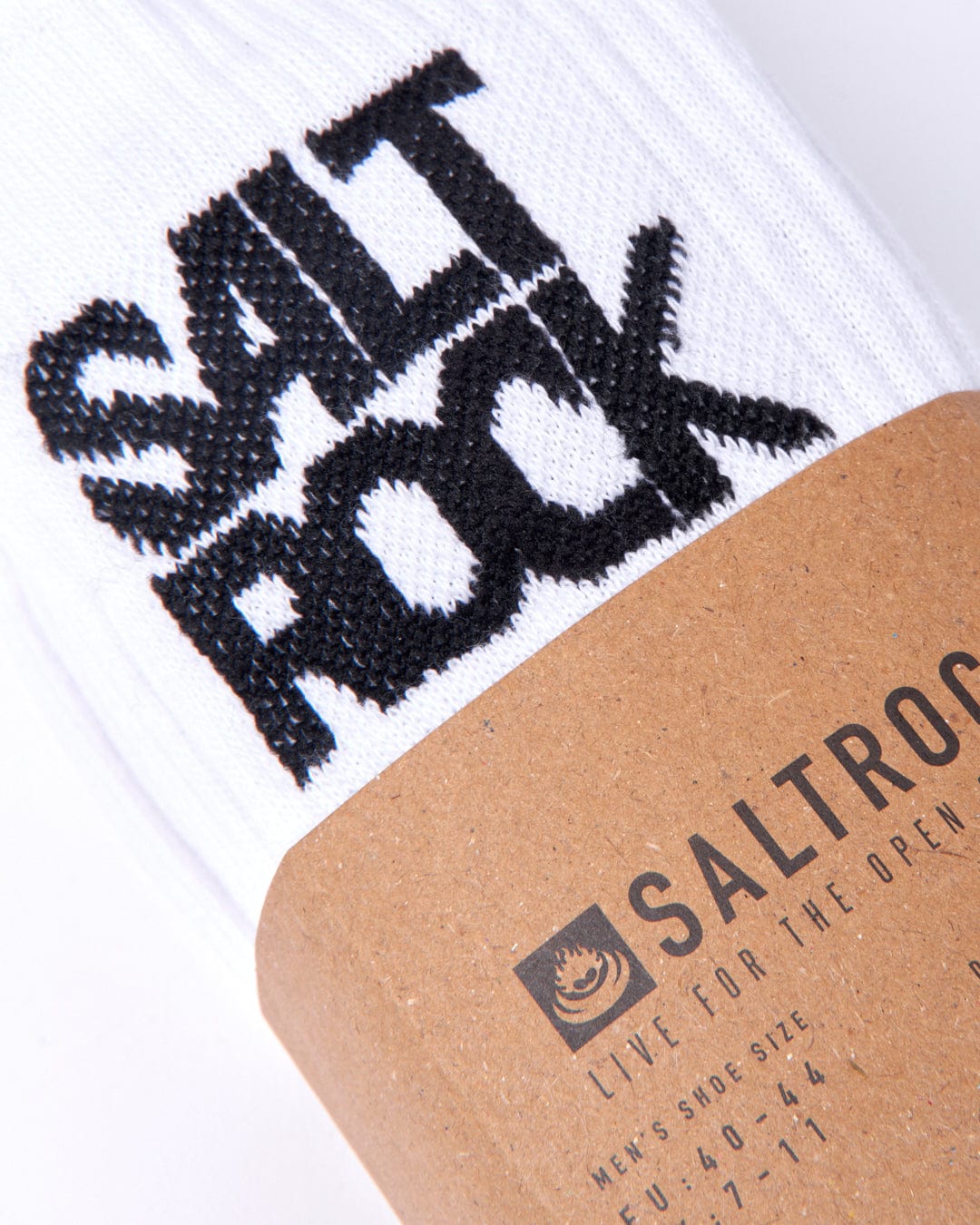 Athletic 3 Pack of Socks - White with the "Saltrock" logo in black, partially covered by a tan band with the brand name and slogan "Live for the open spaces." Made of ribbed thick warm material, these mid-calf length socks are perfect for any adventure.