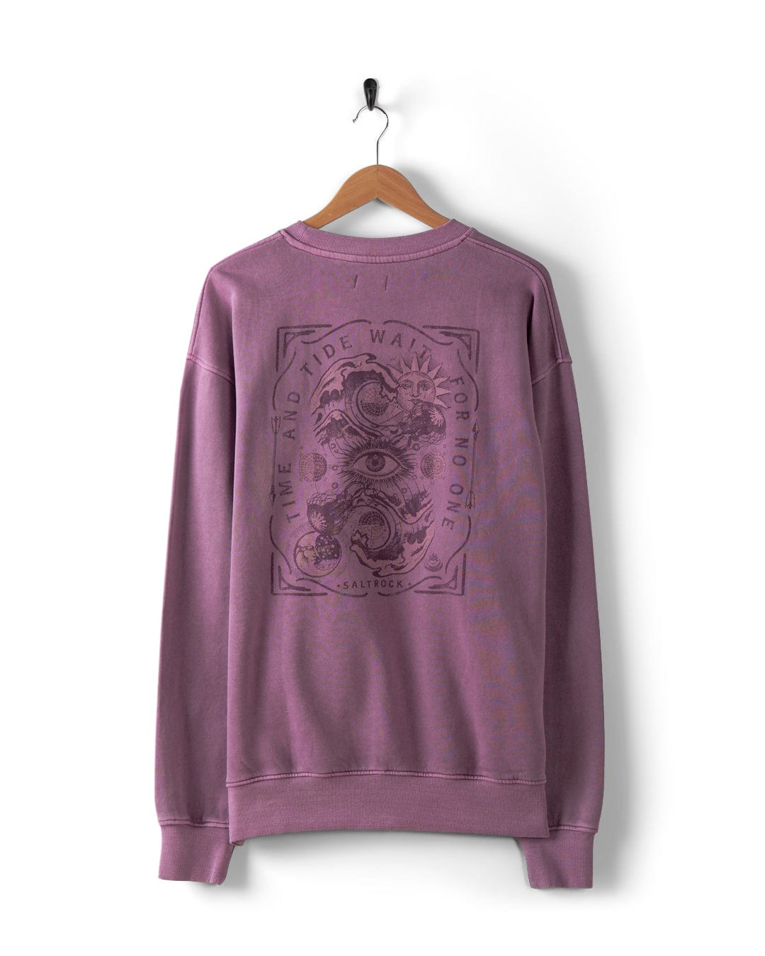 A purple Lunar 2 Men's Oversized Sweat from Saltrock is elegantly displayed on a hanger, featuring an intricate black design with the phrase "The Land and Tide Wait for No One." This stylish piece is perfect for those who prefer an oversized fit.