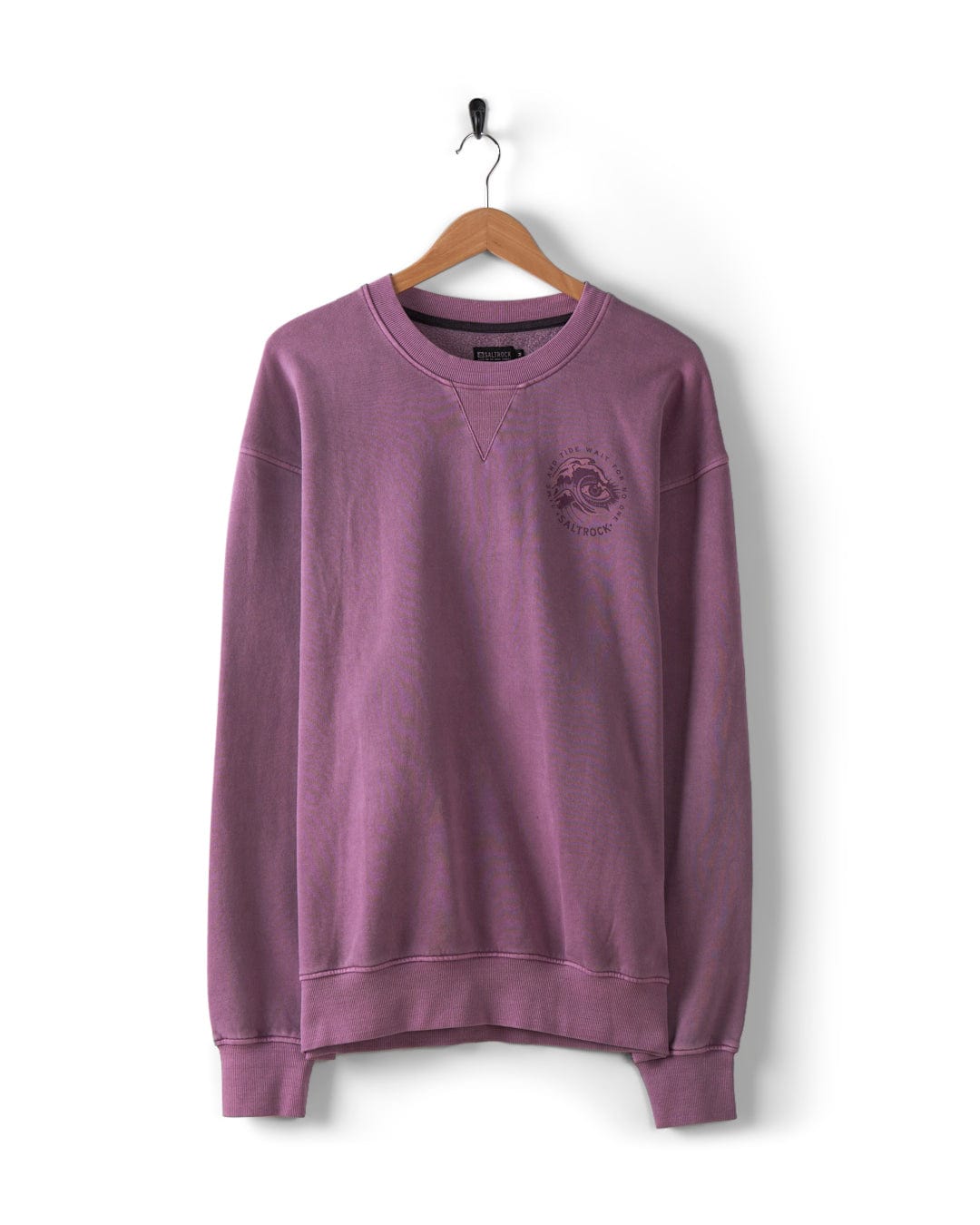 The Saltrock "Lunar 2 - Men's Oversized Sweat" in purple, featuring a washed effect and the Saltrock logo on the left chest, is displayed on a wooden hanger against a white background.