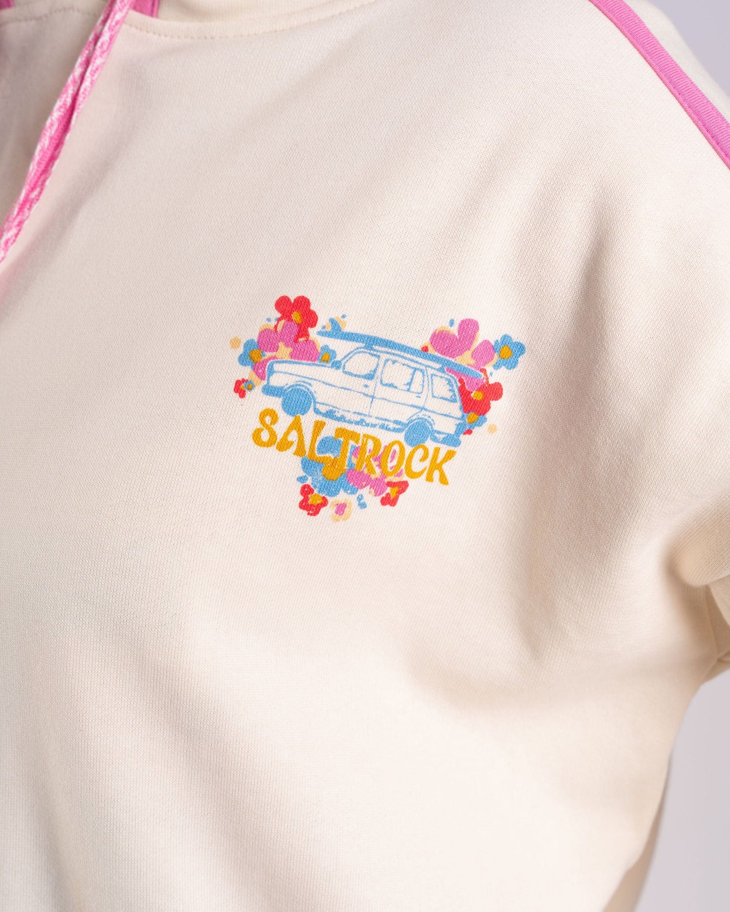 A close-up of the Saltrock Women's Pop Hoodie in cream, featuring a lively design with a van and colorful flowers.