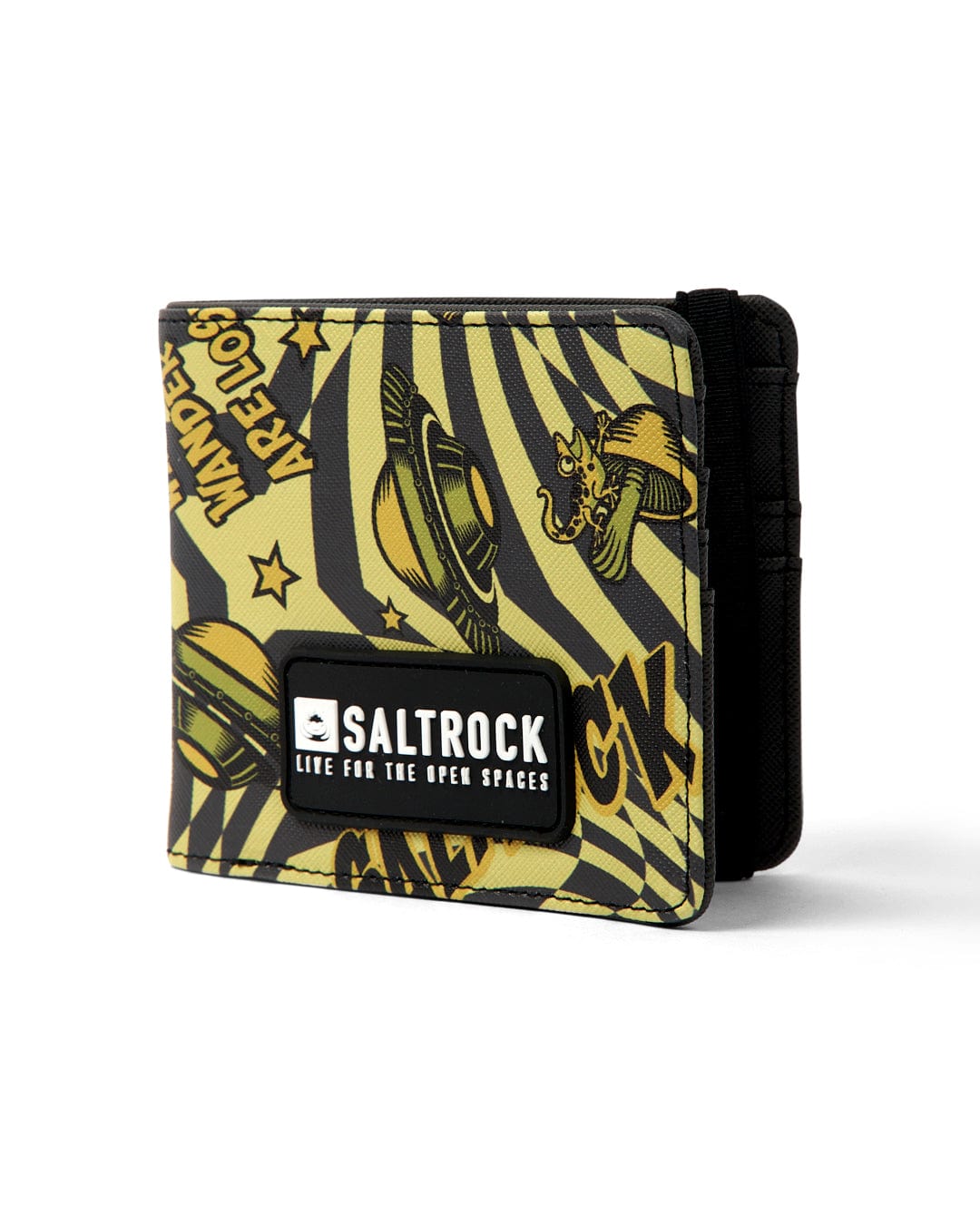 The Saltrock Shroom Warp Wallet in green features a black and green design with yellow comic-style planets and stars. It is foldable, water-resistant, and includes a white patch reading "Life for the Open Spaces," making it perfect for any adventure.