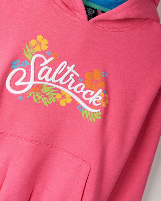 Close-up of a Tropic - Kids Recycled Pop Hoodie - Pink with vibrant floral graphics and the word "Saltrock" printed on the front, crafted from recycled material.