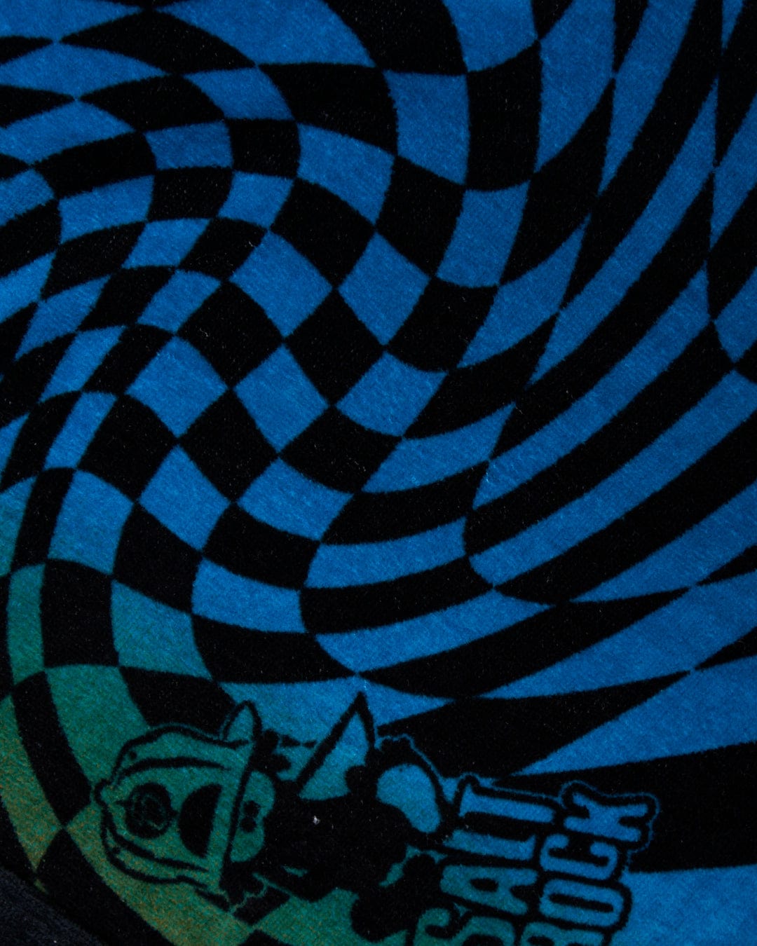 Close-up of a Saltrock Warp Icon - Kids Changing Towel - Blue/Orange with a hypnotic black and blue swirl pattern and a small cartoon character in the corner.